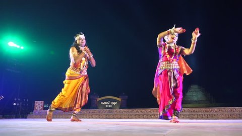 KONARK, INDIA - 3 DECEMBER 2014: Two unidentified dancers on stage during the Konark Dance Festival in India.