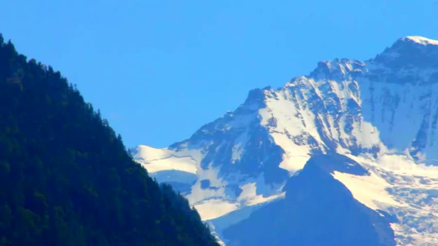View of snowy mountain peak of Jungfrau from Interlaken, Switzerland | Shutterstock HD Video #9515636