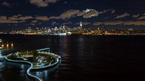 Moonrise over the Empire State Building and Midtown Manhattan looking across the Hudson River, New York. Time-lapse - Powered by Shutterstock - Get 15% off with code: PIKWIZARD15