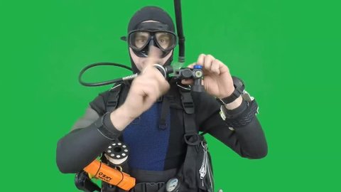 Diving skill- divemaster shows BUTTON'S INFLATOR ,also a available on the green screen all of diving sings from course (open water diver)