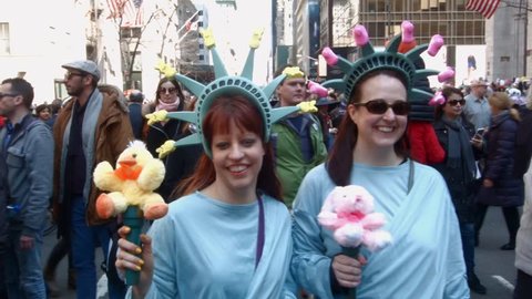 NEW YORK - APRIL 5: Two woman dressed up as The Statue of Liberty during The 2015 Easter Parade and Easter Bonnet Festival in New York City