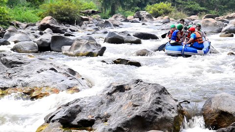 CHIANG MAI THAILAND-MARCH 24 2015: People in inflatable rubber boats sail down Kaeng Kued rafting.Extreme risky recreation. On March 24,2015 in Mae Taeng,Chiang mai,Thailand. 