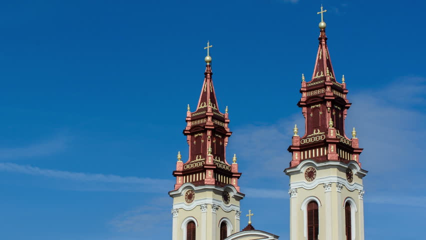 Eastern european greek Catholic christian church clock faces time lapse Arad, Romania 4K