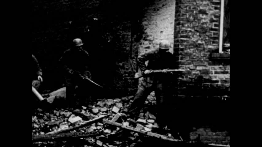 U.S soldiers during a confrontation with Axis powers in Belgian town at the Battle of the Bulge, Ardennes, Belgium circa December 1944