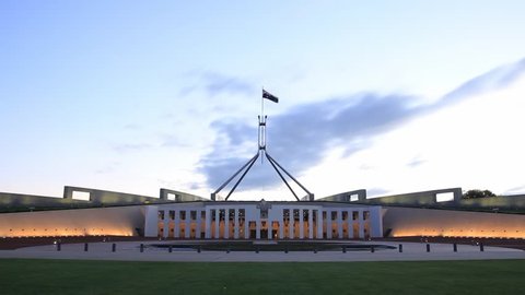 PARLIAMENT HOUSE, CANBERRA - FEBRUARY 2015: Afternoon dusk sunset timelapse of Parliament House, the meeting facility of the Parliament of Australia located in Canberra, the capital of Australia.
