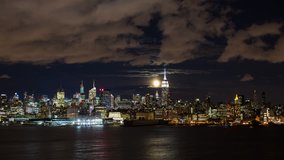 New York - CIRCA NOVEMBER 2014: Moonrise over the Empire State Building and Midtown Manhattan looking across the Hudson River, New York, United States of America, time-lapse - Powered by Shutterstock - Get 15% off with code: PIKWIZARD15