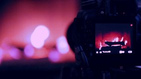 Cute home fireplace video shooting process with DSLR camera Instagram