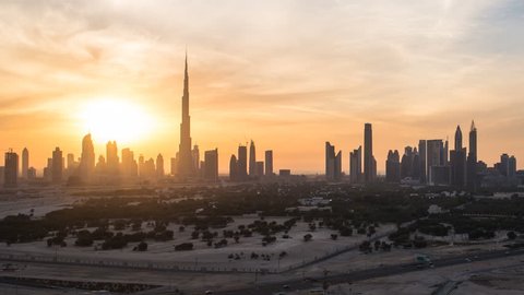 Dubai, United Arab Emirates - CIRCA DECEMBER 2014: Elevated view of the new Dubai skyline, the Burj Khalifa, modern architecture and skyscrapers on Sheikh Zayed Road, time-lapse