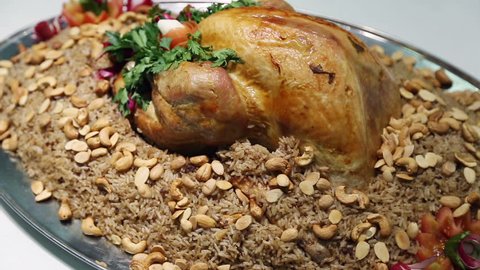 rotating rice and chicken meal, Kabsa
Kabsa is a family of mixed rice dishes that are served mostly in the middle east.These dishes are mainly made from a mixture of spices, rice, meat and vegetables