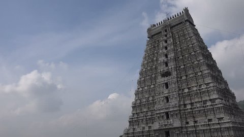 Time lapse view of clouds passing over a tower of the Annamalaiyar Temple complex in Tiruvannamalai, South India.