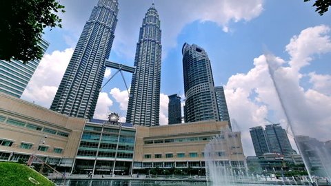 KUALA LUMPUR, MALAYSIA - March 4, 2015: The Petronas Twin Towers with fountain at front in KLCC City Center. The most popular tourist destination in Malaysian capital