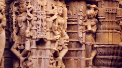 Sandstone sculptures of a Jain temple in Jaisalmer, Rajasthan, India. Panning shot with shallow depth-of-field.
