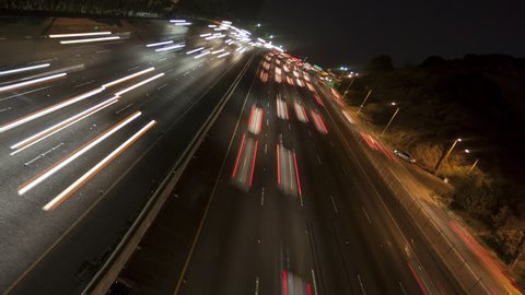 4K Time lapse inclined night motion light trails on a busy Los Angeles freeway