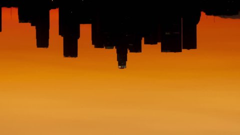 Time lapse rotate sunrise over downtown Los Angeles skyline silhouette with red and orange colored sky