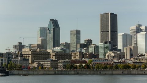 MONTREAL, CANADA - OCT 03. 2014: 4K Time lapse Montreal city skyline over river in the day with urban buildings