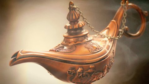 Old Arabic lamp with smoke, magical Aladdin lamp closeup 