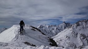 Ski touring in Austrian mountains, beautiful landscape with high peaks in background. Winter adventure and unforgettable experience. Everything what you need for skie video.