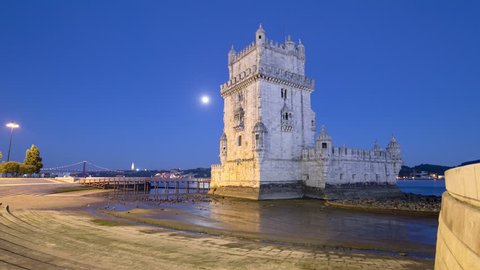 Lisbon, Portugal. Belem Tower (Torre de Belem) is a fortified tower located at the mouth of the Tagus River timelapse hyperlapse with full Moon, lights turning on 4K
