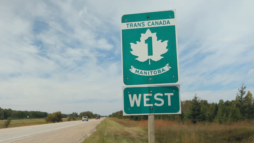 Trans Canada Highway 1 sign in Manitoba, Canada. Handheld. 