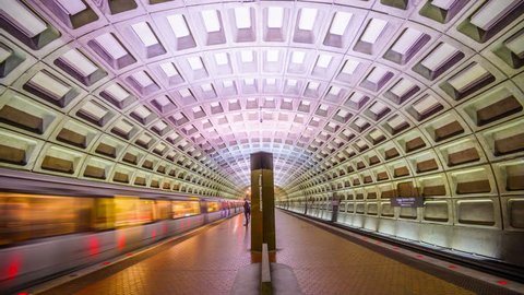 WASHINGTON, D.C. - APRIL 10, 2015: Trains and passengers in the Foggy Bottom-GWU Metro Station. Opened in 1976, the Washington Metro is now the second-busiest rapid transit system in the U.S.