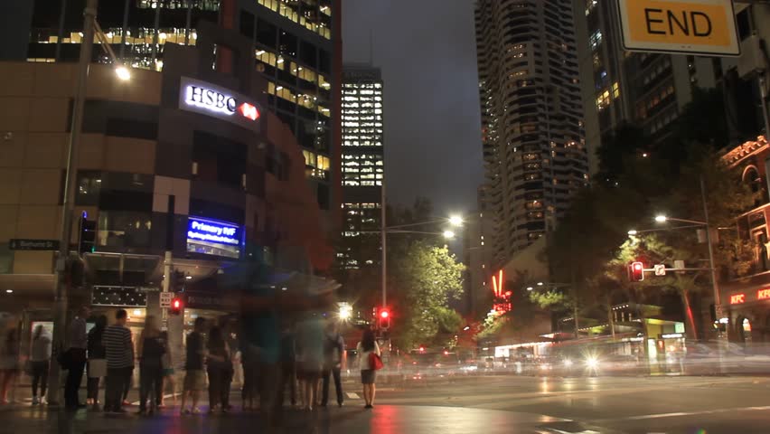 City Street Night Traffic and Pedestrian Time Lapse with people, cars and buses. Night city footage shot on the streets of Sydney Australia but would suit any generic city street scene.
