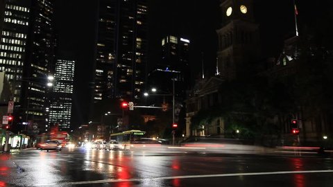 City Street Night Traffic and Pedestrian Time Lapse with people, cars and buses. Night city footage shot on the streets of Sydney Australia but would suit any generic city street scene.