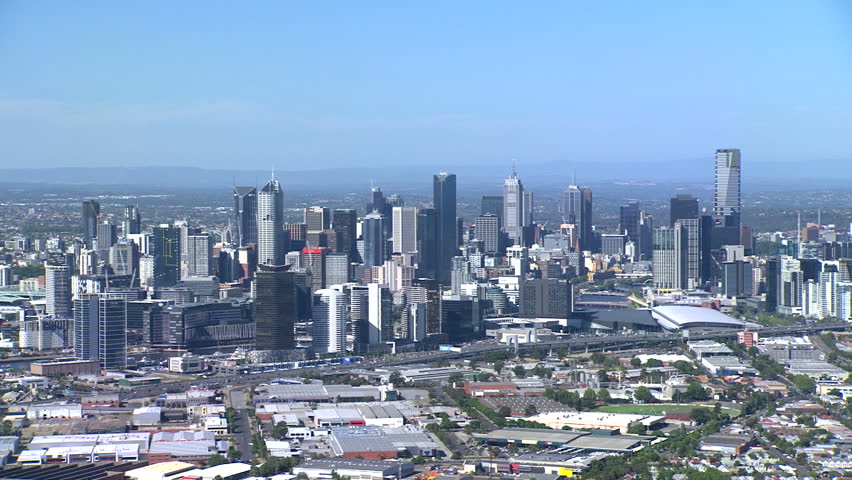 A wide sweeping aerial shot of Melbourne City, Victoria, Australia, from a helicopter.