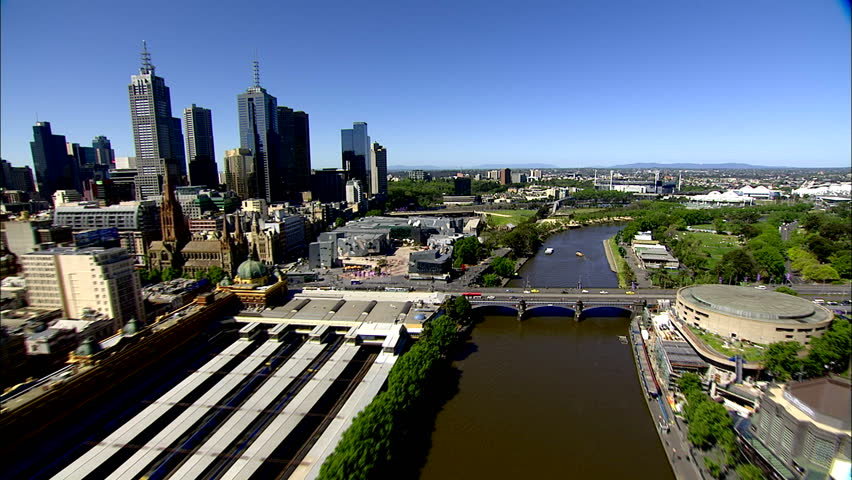 An aerial shot of Melbourne City, along the Yarra River from Docklands towards the MCG, on a sunny blue sky summer day.