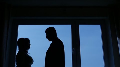 silhouettes of man and woman, angry woman try to clarify the relationship in quarrel and slap in man face 1