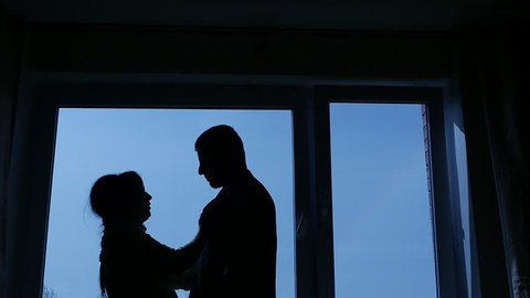 silhouettes of man and woman, angry woman try to clarify the relationship in quarrel and slap in man face 2