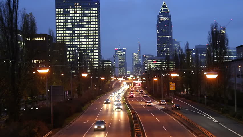 Late in the evening - City traffic in Frankfurt Germany. Buildings in background