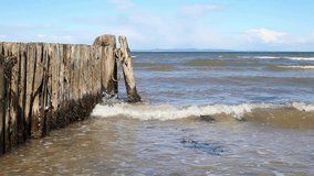 Wooden Wave Breaker on European Beach Coast Footage Video