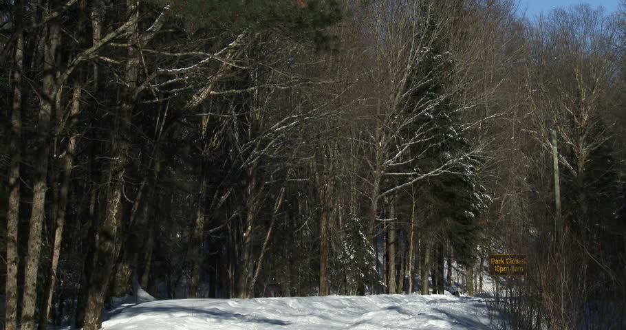 Snowy and icy trail in winter in the woods of Algonquin Provincial Park, one of the biggest and most important parks in Ontario, Canada
