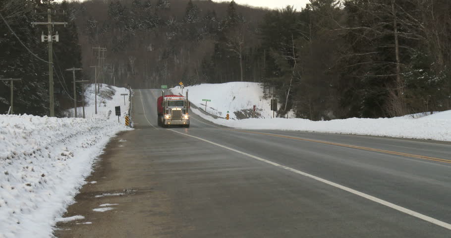 Truck driving on highway 60 in Algonquin Provincial Park, Ontario, Canada
