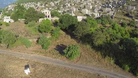 Aerial view of the ghost town of Kayakoy. A reminder of the fragility of harmony between cultures. Ministry of Culture rescued the town from mass development by granting it museum status in 2000s. 
