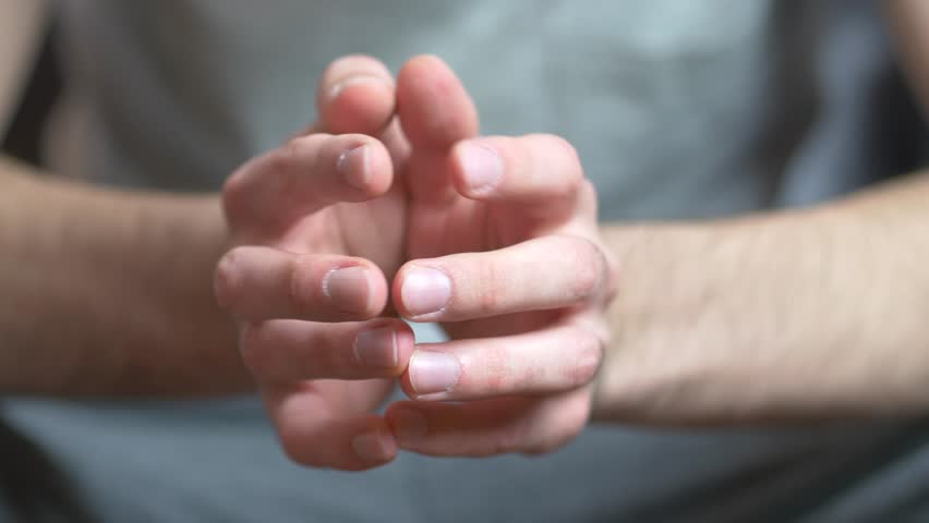 Hands of a caucasian man hesitating and being bored by taping fingers together. | Shutterstock HD Video #9603611