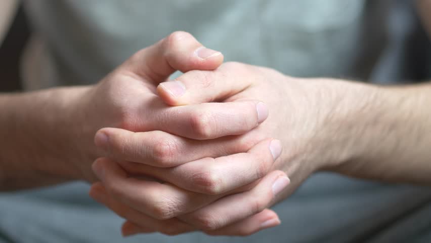 Hands of a caucasian adult man being anxious, nervous and uncomfortable. | Shutterstock HD Video #9603617