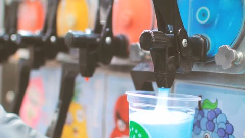 Slushie slush ice sugar drink poured from machine