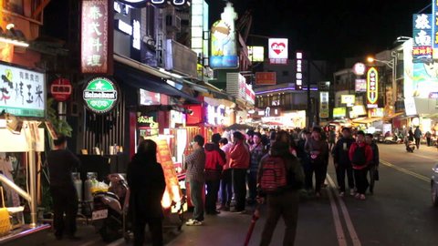 Kenting, Pingtung, Taiwan- February 05, 2015: Night Market at Kenting Street at Night, There are Many People and Many Restaurants and also Delicious Foods. HD