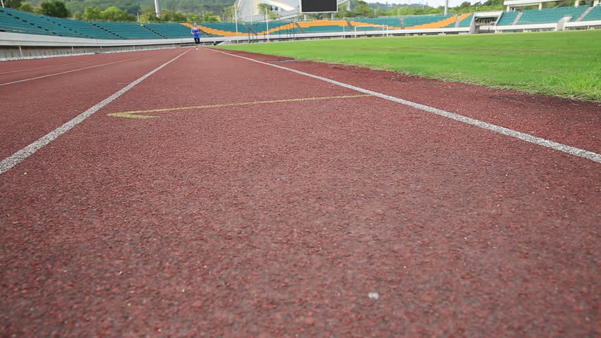 young fitness woman runner running on track