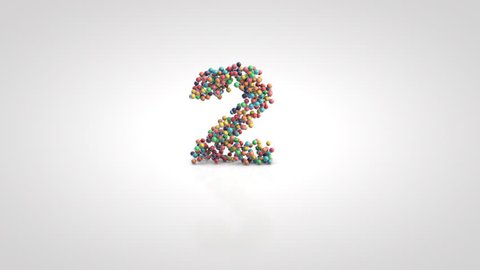 Number 2 with moving a swarm of glossy colorful 3d balls on a white background