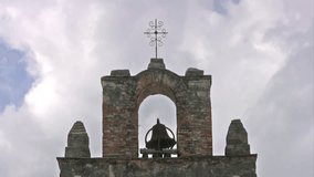 Video real time of cross on top of the old Spanish Mission Espada San Antonio, Texas. Built in 1720's by missionaries and local Indians. 
