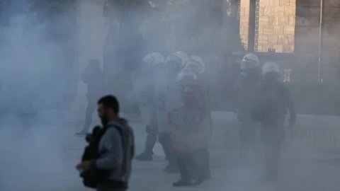 ATHENS, GREECE - APR 16, 2015: Leftist and anarchist groups seeking the abolition of new maximum security prisons, clashed with riot police, who responded with tear gas and stun grenades. 