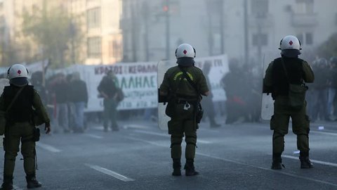 ATHENS, GREECE - APR 16, 2015: Leftist and anarchist groups seeking the abolition of new maximum security prisons, clashed with riot police, who responded with tear gas and stun grenades. 