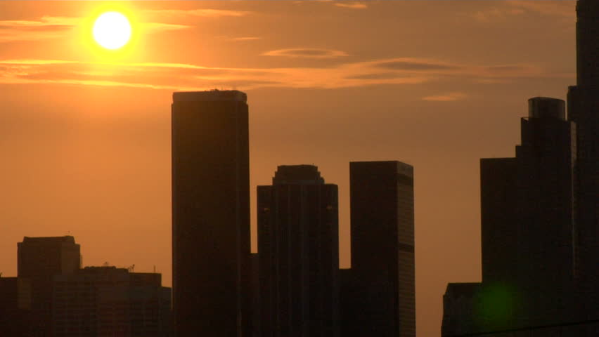 A timelapse shot of a sunset over downtown Los Angeles.  The Sun moves behind