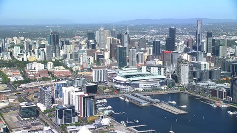 An aerial shot of Melbourne City, along the Yarra River towards Docklands and Etihad Stadium on a sunny blue sky summer day.
