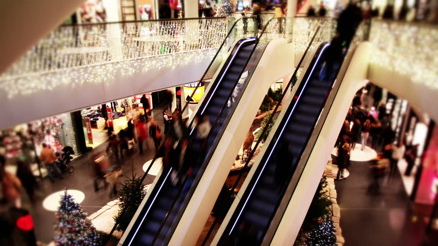Consumer on 2 escalators in shopping mall  - Time lapse