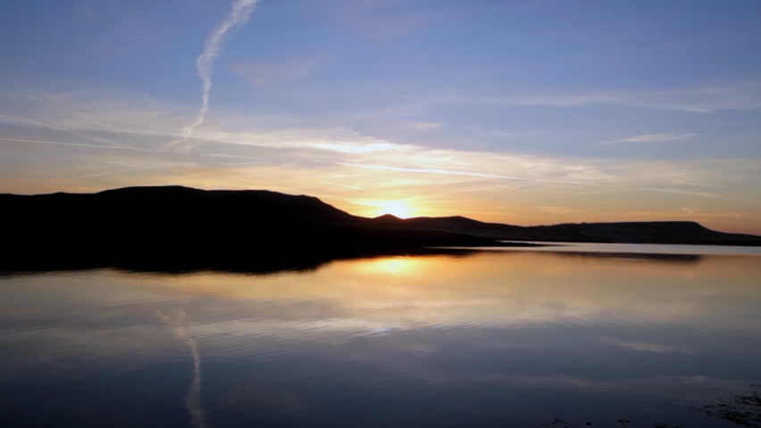 sunrise on morning lake with mountain 