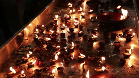 Burning candles in the Indian temple. Diwali – the festival of lights. Adlı Stok Video