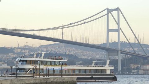Istanbul, Turkey, October, 2014. A Time-lapse of the sun coming down from day to night-Sunset for the famous Bosphorus bridge in the middle - Istanbul, Turkey.